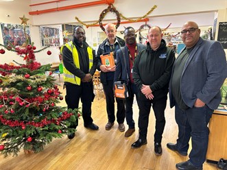 Staff in the community centre pose with the new defibrillator